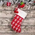 Knitted red Christmas stocking with white tree patterns and decorative poms - Christmas Tree