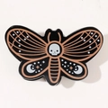 Pinza para pelo de mariposa gótica con estrellas lunas naranjas y calavera central - Mariposa