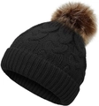 Close-up of thick cable knit texture and brown faux fur pompom on black winter hat - Black