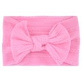 Close-up of pink cable knit baby headband with a large decorative soft bow detail - Pink