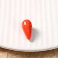 Detail of teardrop resin bead in orange-red with polished smooth coral texture - 1 Piece / Orange