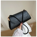 Detail view of black crocodile pattern leather bag with elegant gold metal buckle closure - Black