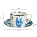 Italian style ceramic coffee cup and saucer set with blue Hamsa hand and gold star detail - Hamsa Hand Cup & Saucer Set