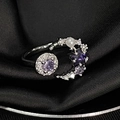 Close-up of adjustable silver moon and star ring with purple gems and white pearl detail - Adjustable Open / Silver Moon Star Pearl