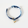Close-up of blue Japanese wave pattern pet collar with white cat-shaped buckle and gold bell - S (17-32cm) / Blue Japanese Style