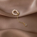 Detail of freshwater pearl ear cuff featuring a gold tassel with a teardrop zircon pendant - Waterdrop Style