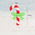 Close-up of candy cane cake topper with green bow, 5cm width by 6.5cm height size detail - Soft Glue Candy Cane