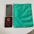 Portable green nylon organizer bag size comparison with a smartphone and a passport - 30*23 / Green