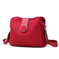 Red multilayer nylon crossbody bag with adjustable strap and circular metal buckle detail - Red
