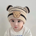 Baby knitted striped beanie with bear ears and patch on an infant model beige color - Creamy White - Striped Bear