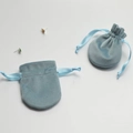 Detailed view of light blue velvet drawstring jewelry pouches with soft fabric texture - 7x8.5cm / Sky Blue