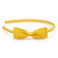 Close-up of bright yellow grosgrain ribbon bow and fabric-wrapped headband for women - Yellow