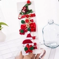 Set of 8 festive Christmas hair clips with glitter hats and bows on display card - 10-Piece Green Christmas Hat Set