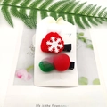 Detail of Christmas hair clips featuring knitted mini hat and plush snowballs set - 2-Piece Small Snowflake Hat Pom Set
