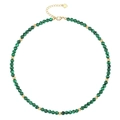 Detail of beaded necklace featuring green malachite stones and golden heart pendant - Malachite Necklace