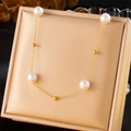 Elegant gold-plated stainless steel chain necklace with pearls on a soft beige cushion - Pearl Chain Necklace (N2785)