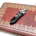 Detailed view of gothic silver necklace with black hexagonal stone and purple crystal - Obsidian