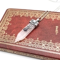 Macro detail of rose quartz hexagonal prism necklace with vintage silver filigree cap - Rose Quartz