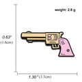 Broche revolver rose et or avec dimensions et poids de 2,8g sur fond blanc - Revolver Or Rose