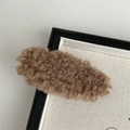 Detailed close-up of a brown plush cloud hair clip with soft fuzzy teddy texture - Light Coffee