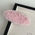 Detail of a pink cloud-shaped plush hair clip with soft fuzzy texture in a frame - Pink