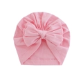 Pink infant turban hat featuring a large soft bow, made of breathable knit fabric - Pink