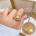 Detail view of gold flower ring featuring pearl accents and sparkling zirconia stones - Five-Petal Flower Pearl Adjustable Ring (J0089)
