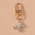 Detail of a bicolored balloon dog keychain with golden lobster clasp and silver pendant - Silver