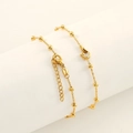 Macro shot of 18K gold plated bead chain with flame pendant and sparkling zircon - Single Zirconia Flame Pendant (ZH1736G)