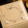 Zilveren roestvrijstalen kettingarmband met witte vlinderhangers en ronde kralen - Zilver Vlinder Kraal Stijl (B1354)