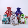 Detailed view of colorful Christmas drawstring gift bags with festive laser foil patterns - 5 Designs 6pcs Each (Set of 30)