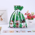 Detailed view of green Christmas gift bag with Santa Claus pattern and drawstring ribbons - Christmas Small Green 24*32