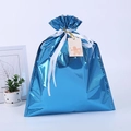 Detail of laser film blue drawstring gift bag with white ribbon and gingerbread tag - Laser Blue 51*38