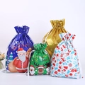 Assorted colorful Christmas drawstring gift bags with festive Santa and reindeer patterns - Set of 60 (4 Small Designs 10pcs Each, Large 5pcs Each)