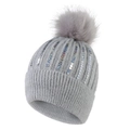 Close-up of a grey knit beanie with colorful sequins and a fluffy faux fur pompom top - Adult / Light Gray