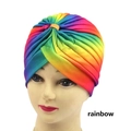 Macro detail of pleated rainbow turban hat on a mannequin head with colorful gradient fabric - One Size / Rainbow