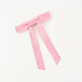 Detail of pink velvet bow hair clip with long ribbons on a white background - Pink