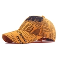 Vintage newspaper print baseball cap in yellow for a classic retro street look. - Yellow