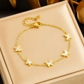 Elegant gold chain bracelet with five white shell butterfly charms in a jewelry box - Butterfly Bracelet (B1387)
