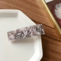 Rectangle acetate hair clip with pink and grey marble texture on a ceramic plate - Floral Grey
