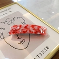 Red and white marble pattern acetate hair clip with a polished finish and metal base - Floral Red