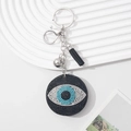 Evil eye keychain with blue rhinestones and black tassel on a silver metal ring - Black