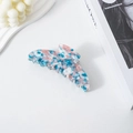 Blue and pink mottled acetate banana hair claw clip shown on a white tabletop background - Blue and White Floral