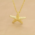 Close-up of golden starfish pendant with detailed texture on silk background - Starfish Pendant (A)