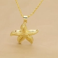Detail view of a golden starfish pendant necklace with fine texture and twist chain - Golden Starfish (C)