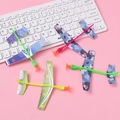 Set of 4 foam catapult planes with camouflage patterns in blue and green on pink background - Catapult Foam Plane