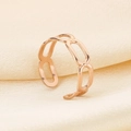Detailed view of rose gold hollow chain ring on elegant silk fabric background - Hollow Interwoven Chain Style (KR105021-KFC)