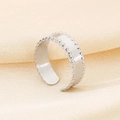 Macro shot of silver titanium ring with beaded edges on elegant champagne silk background - Beaded Edge Style (KR107849-KFC) - Steel Color