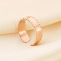 Close-up of rose gold textured ring with beaded edges on elegant silk background - Beaded Edge Style (KR107851-KFC) - Rose Gold