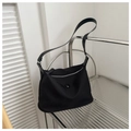 Detail of durable black nylon shoulder bag with silver zipper and decorative round buckle - Black